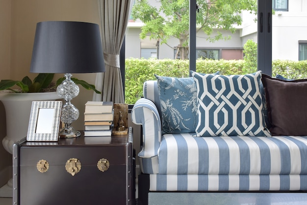 Blue pattern pillows on striped sofa 