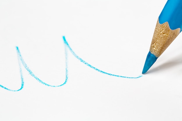 Blue pencil draws a wavy line