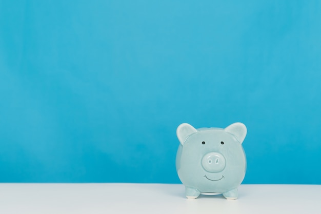 Blue piggy piggy bank on a blue background