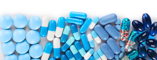 Blue pills isolated on white