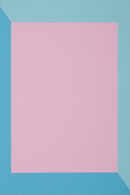 Blue and pink background, colored paper geometrically divides into zones