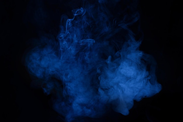 Blue and pink steam on a black background. Copy space.