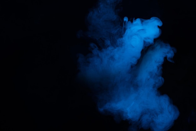 Blue and pink steam on a black background. Copy space.