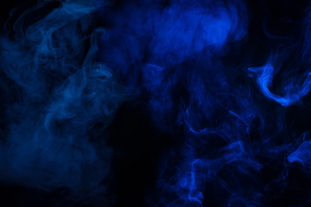 Photo blue and pink steam on a black background. copy space.