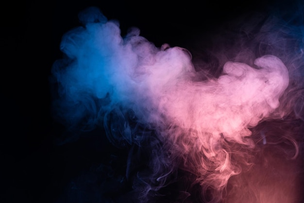 Photo blue and pink steam on a black background