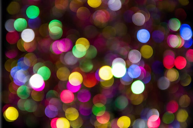 Blue pink yellow blurred festive bokeh Christmas holiday background