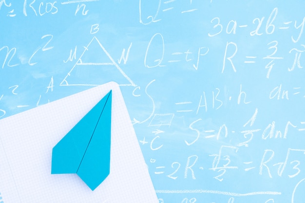 Photo blue plane over math equations background