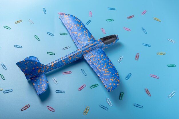 Blue plane among multicolored figures Different shapes and patterns Multicolored details