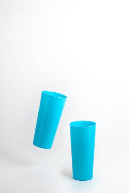 Blue plastic cup isolated on white background