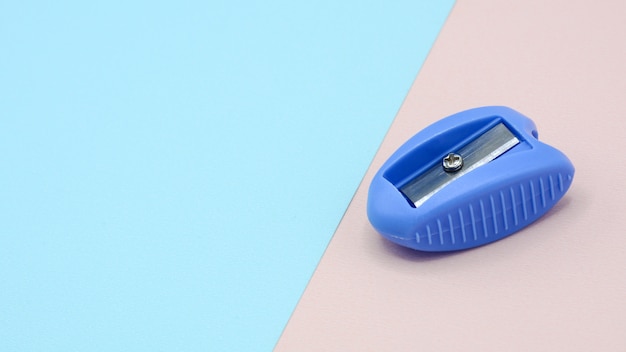 Blue plastic pencil sharpener - background