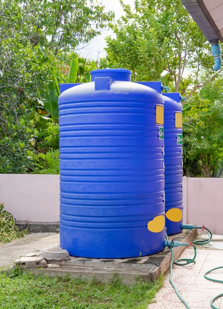 Photo blue plastic water tanks.