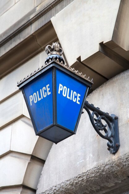 Blue Police Station Sign on Facade