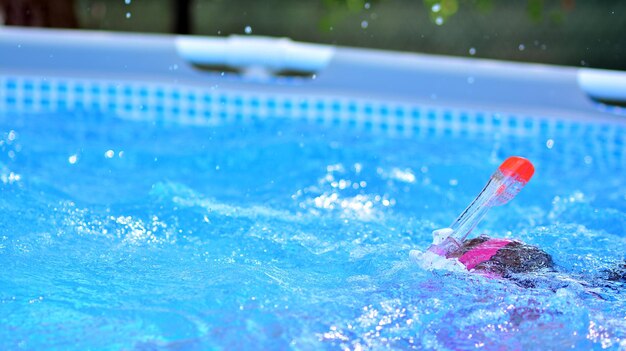 A blue pool with a pink object in it