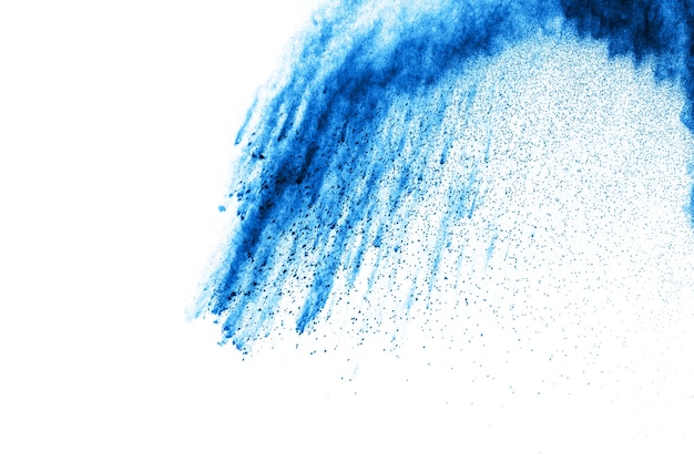 Blue powder explosion on white background.