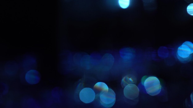 青と紫のボケ味のキラキラ ヴィンテージ ライトの背景