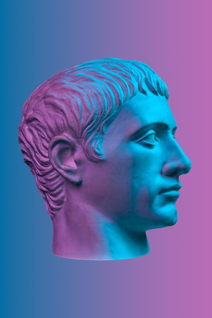 Blue purple gypsum copy of ancient statue of Germanicus Julius Caesar head for artists isolated on color background Renaissance epoch Plaster sculpture of man face Template for art design