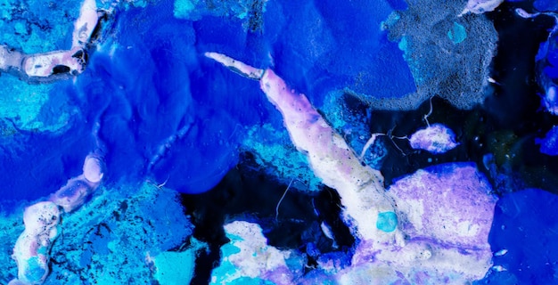 A blue and purple painting of a fish