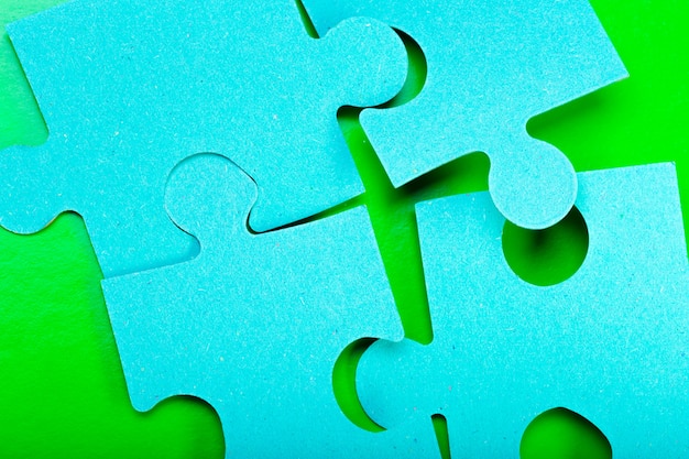 blue puzzle pieces on green