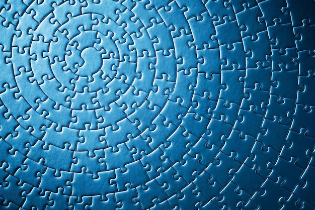 A blue puzzle with a spiral pattern.