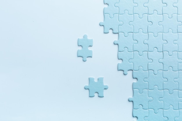 Blue puzzles on both sides with separate elements