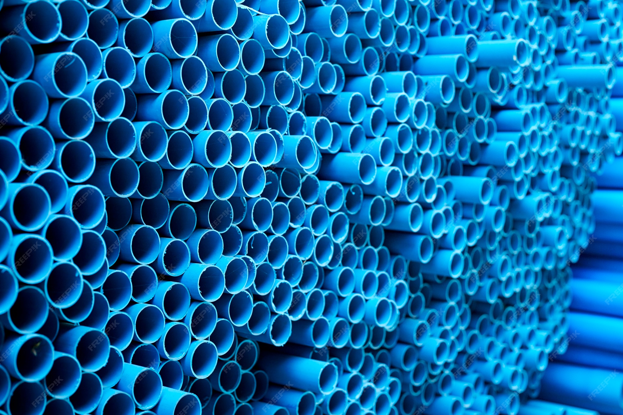 Premium Photo Blue PVC pipes stacked