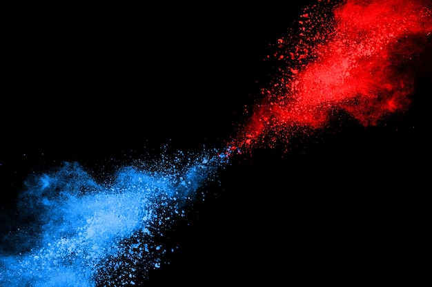 Blue and Red color powder explosion on black background