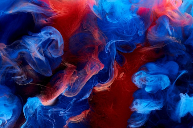 Blue red ink abstract background Acrylic paint backdrop for perfume hookah cosmetics Mysterious smoke clouds colorful fog