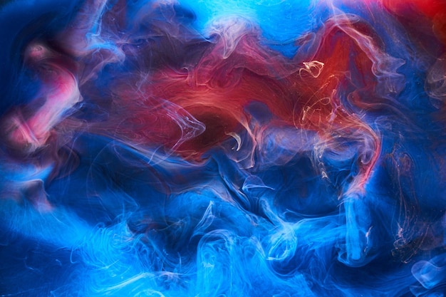 Blue red ink abstract background Acrylic paint backdrop for perfume hookah cosmetics Mysterious smoke clouds colorful fog