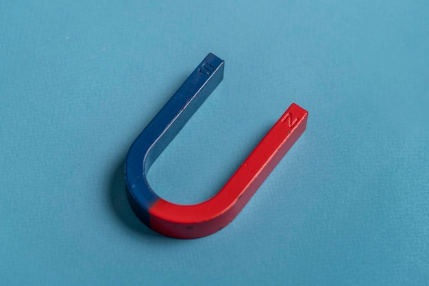 A blue and red magnet in form of horseshoe for studying purpose