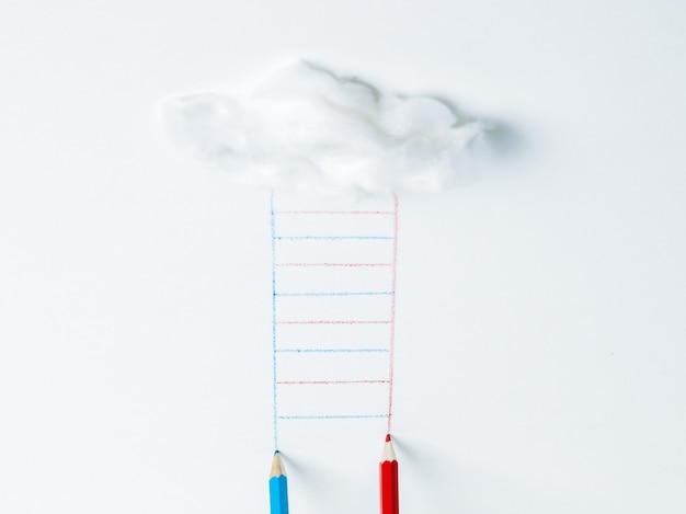 Blue and red pencils drawing a ladder from a cloud. The concept of development.