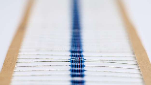 Photo blue resistor in rowresistor on white background