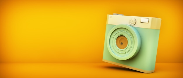 Blue retro camera on yellow background