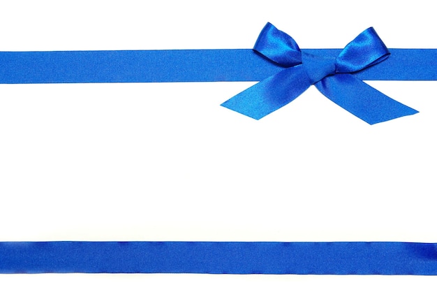 Blue ribbon and bow on white background