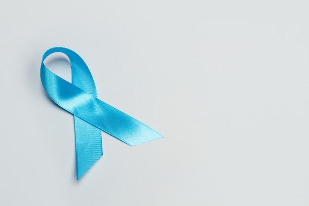 A blue ribbon on a gray background