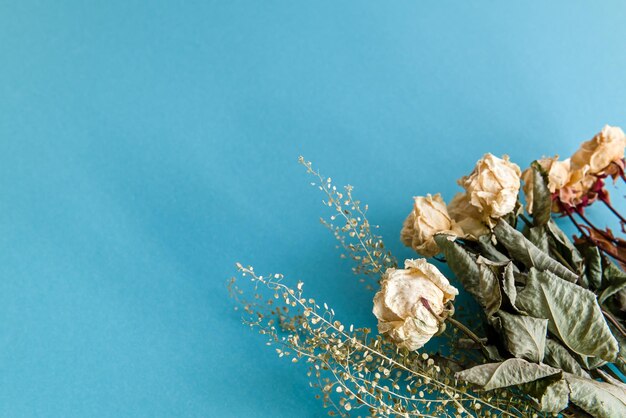 Blue romantic background with flowers and copy space