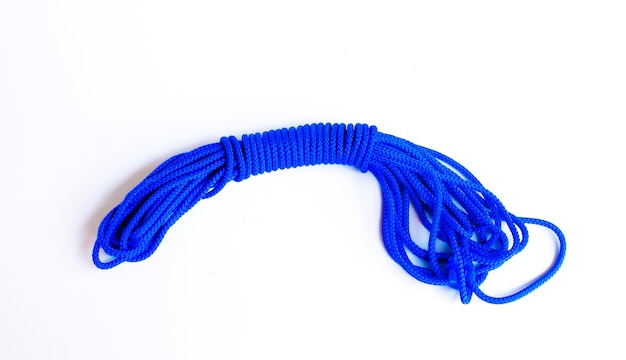 Blue rope for climbing equipment on a white background