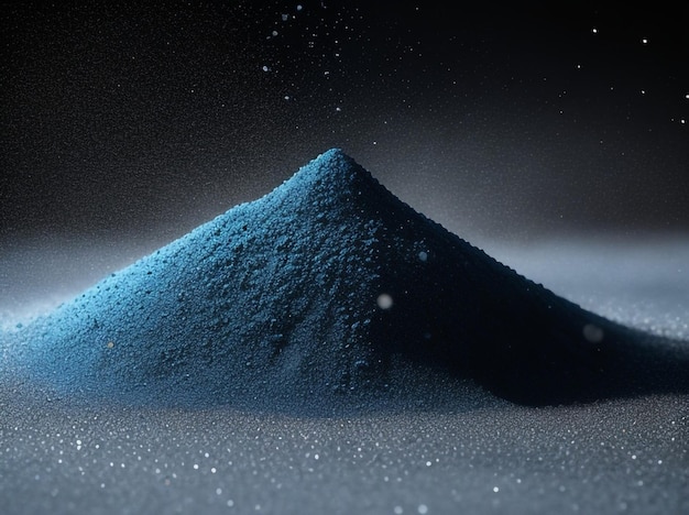 Фото Танец с синим песком. крупный план песка, брошенного в воздух.