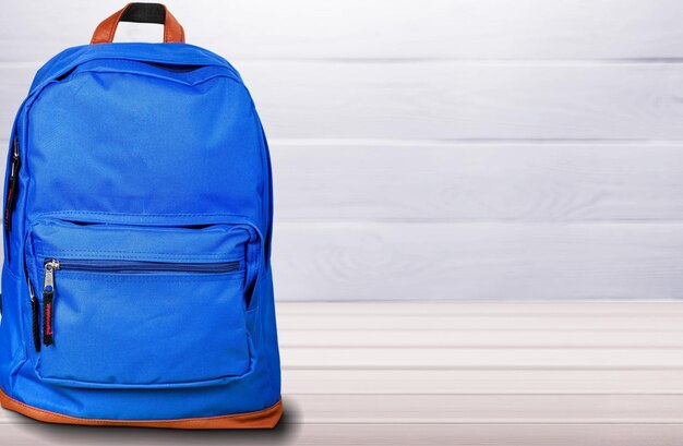 Blue school bag on background