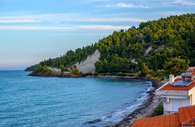 Blue sea and beach with forest in Fourka Scala, Halkidiki, Greece