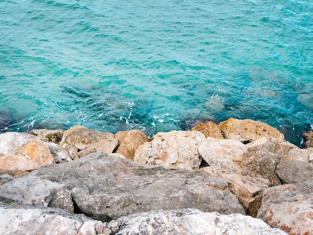 Blue sea and grey rocks Photo from above