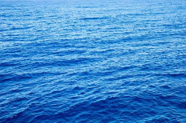 Blue sea surface with waves