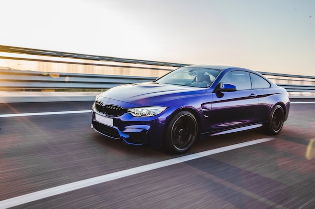 Photo blue sedan speed drive on the highway