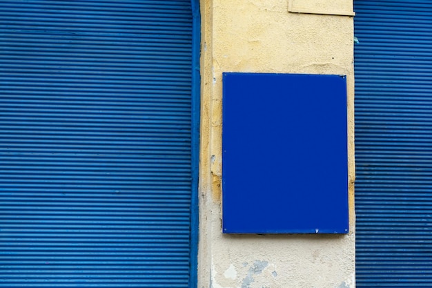 Blue sign board and wooden window front advertising board space for text Budapest city street travel concept