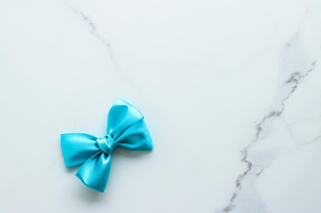 Blue silk ribbon on marble top view