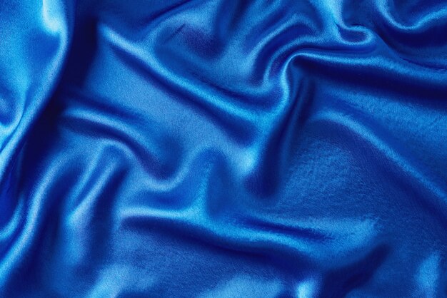 Blue silk with folds.  Abstract texture of rippled satin surface