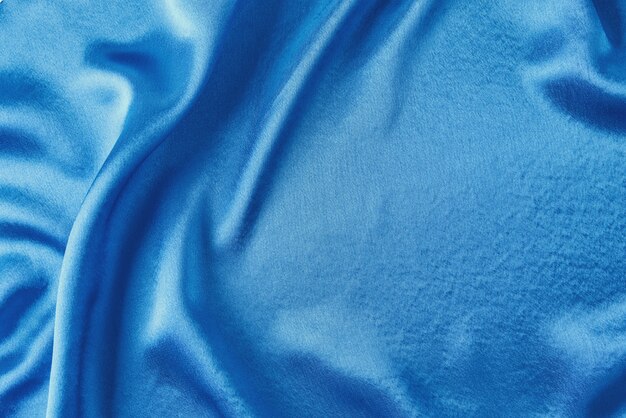 Blue silk with folds.  Abstract texture of rippled satin surface