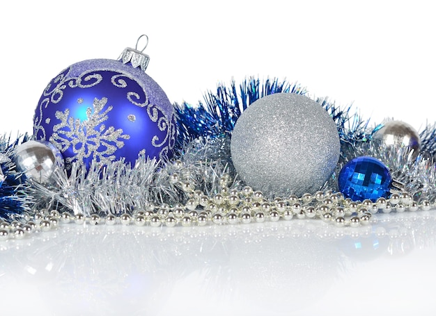 Blue and silver Christmas decorations on a white background