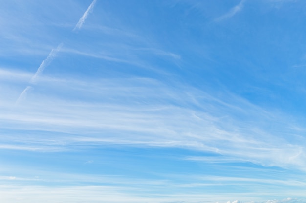 Blue sky background texture with white clouds.