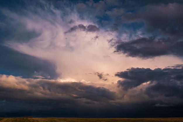 Blue sky background with dark striped clouds before storm blue sky panorama may use for sky replacement