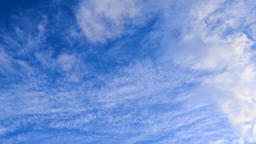 Premium Photo | Blue sky background with fuzzy clouds